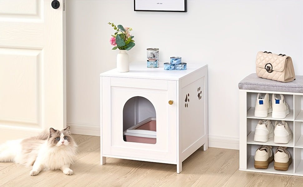 Bac à litière discret pour chat, intégré dans un meuble de design contemporain.