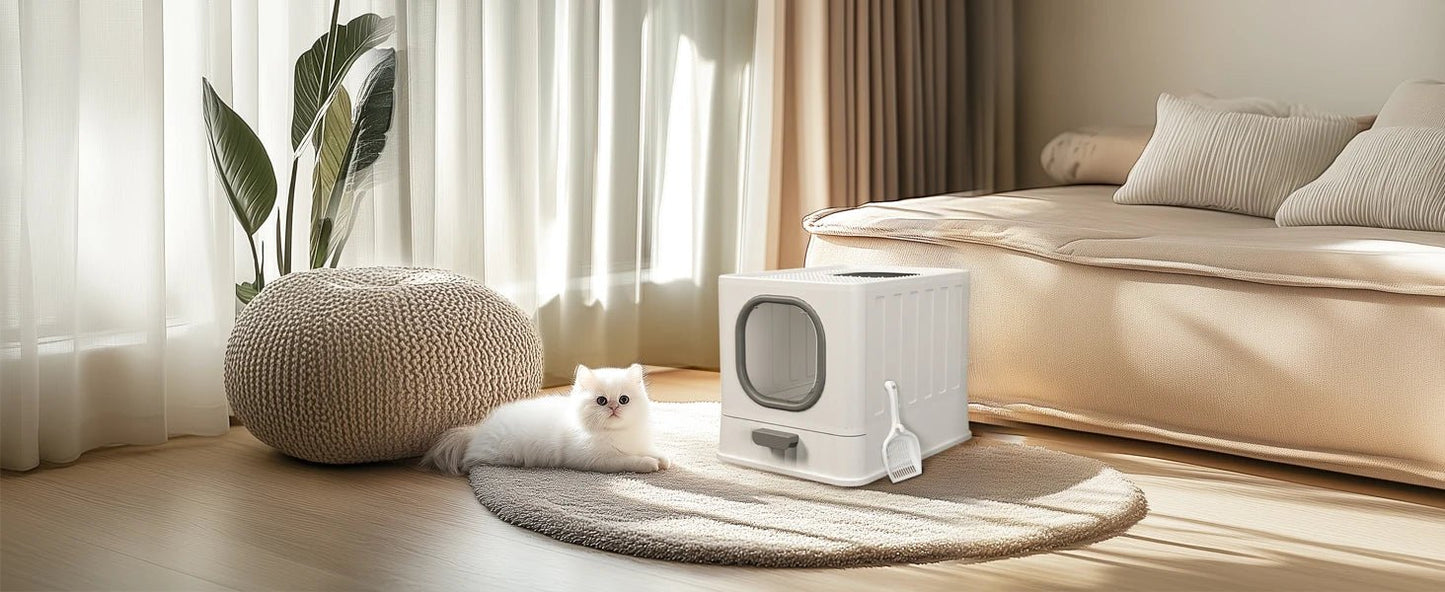 Boîte à litière chat design avec tiroir dans une salle de bain, utilisée par un chaton