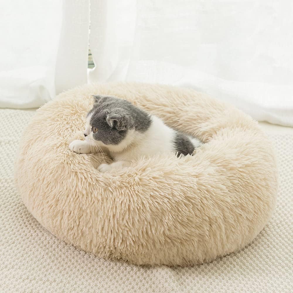 Lit apaisant pour chat en forme de donut : relaxation optimale.