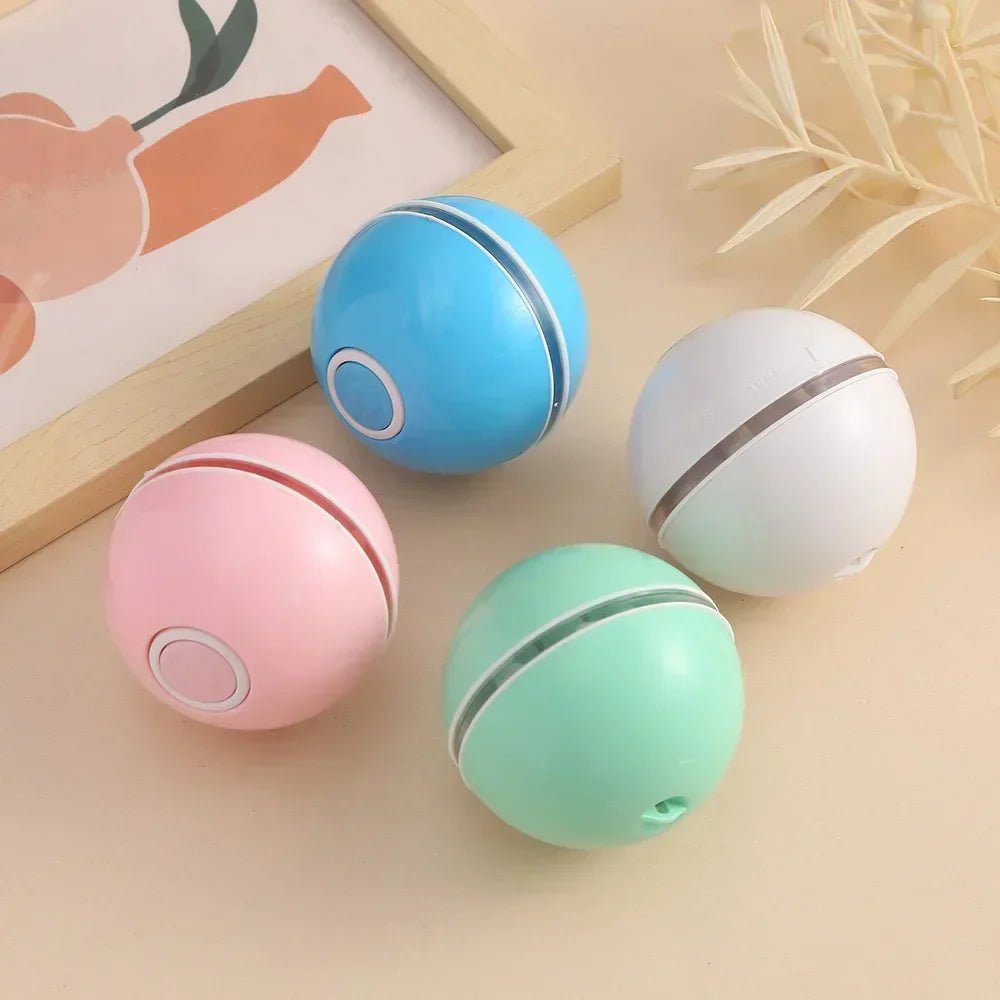 Balle interactive lumineuse pour chat disponible en blanc, bleu et rose