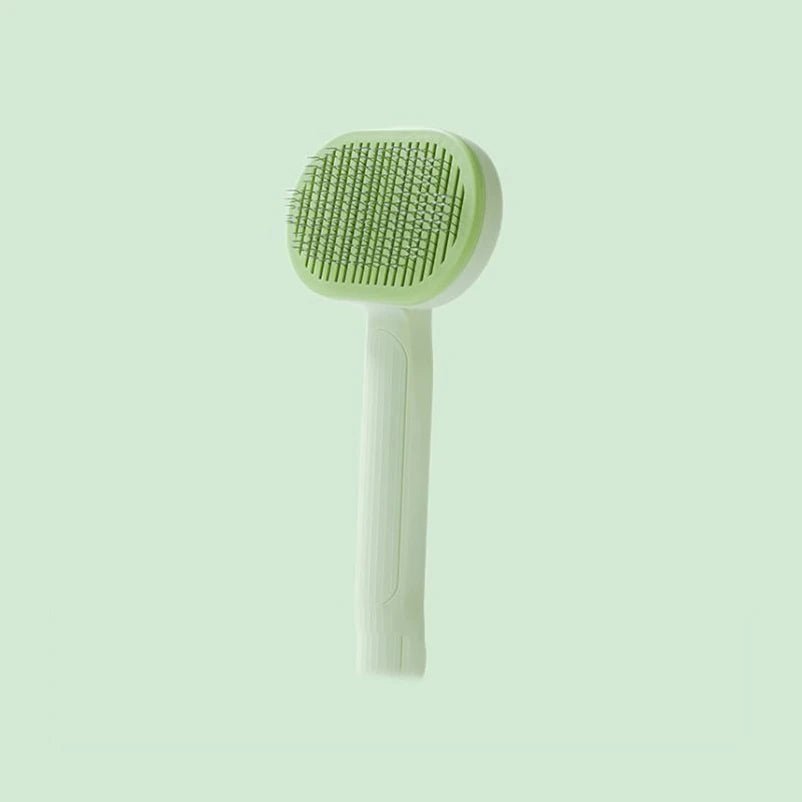 Brosse démêlante verte pour chat, embouts caoutchouc protecteurs et éjection des poils en un clic