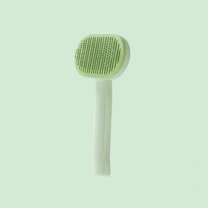 Brosse démêlante verte pour chat, embouts caoutchouc protecteurs et éjection des poils en un clic